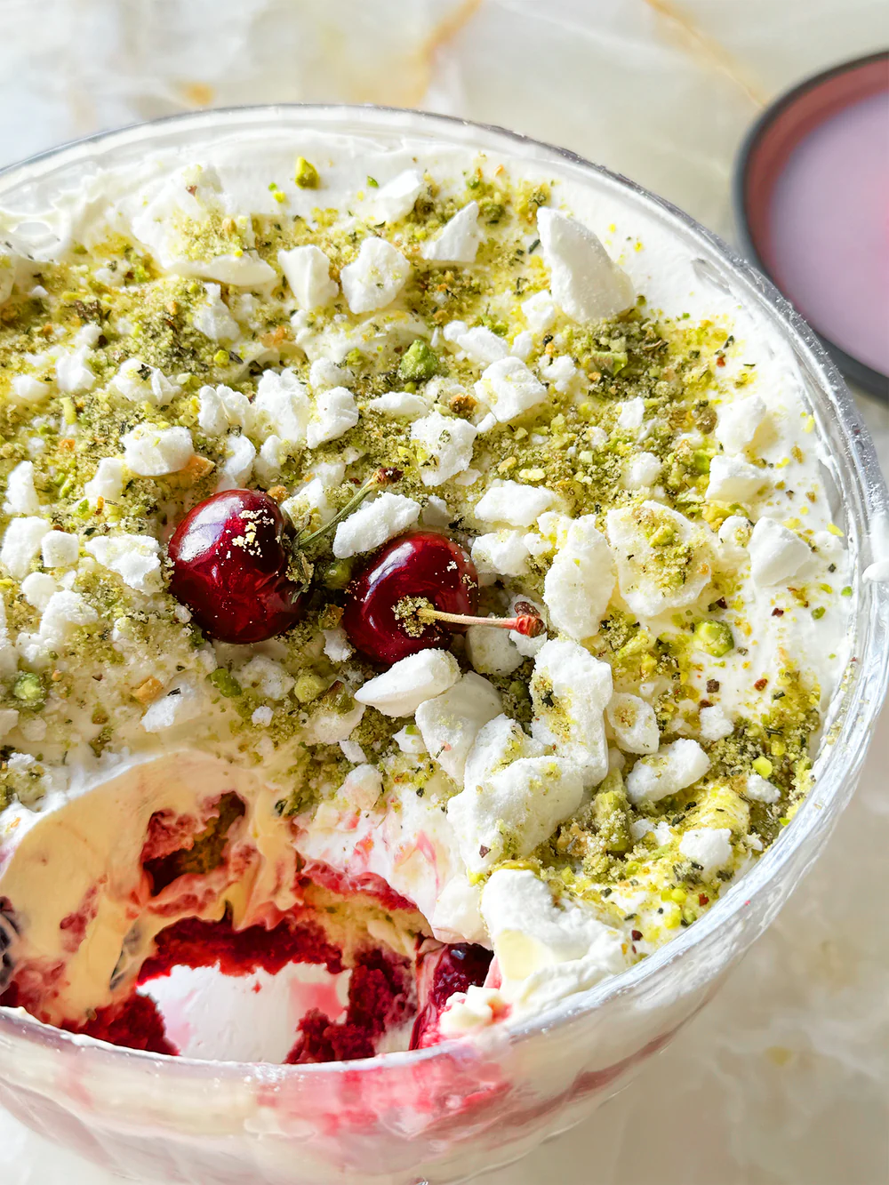 Cherry trifle with pistachio and rosemary crumble.png
